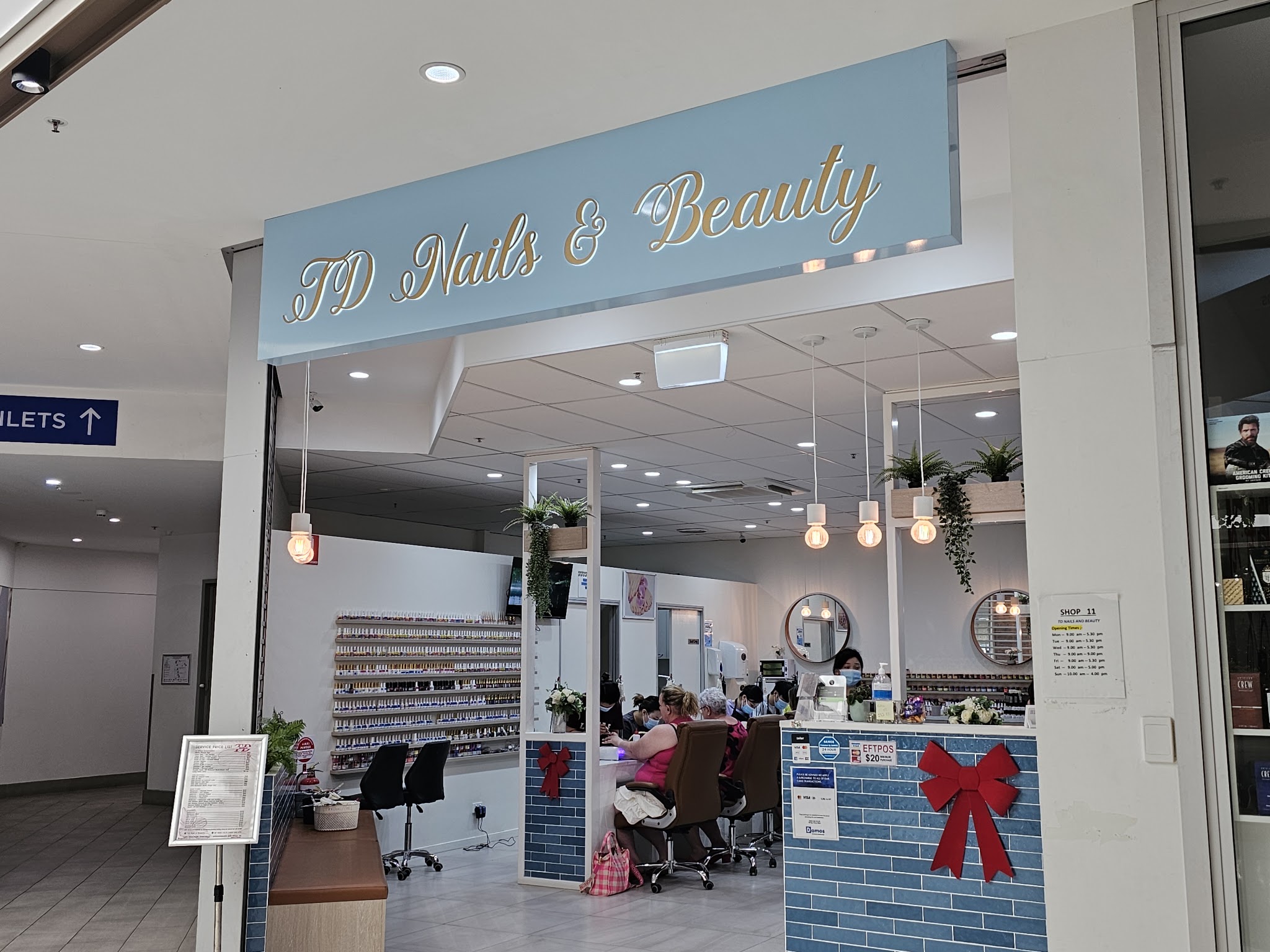 The TD Nails and Beauty shopfront in Wilsonton Shopping Centre, with its powder blue sign in gold script